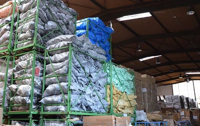 Sacks filled with shoes and textiles